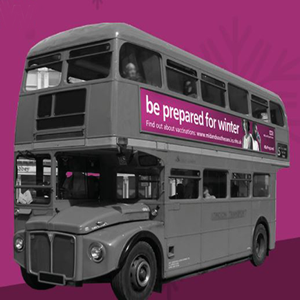 Vaccination bus in grey mono colour with a purple background